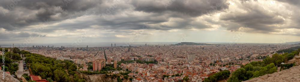 Panoramic view of Barcelona under rain clouds