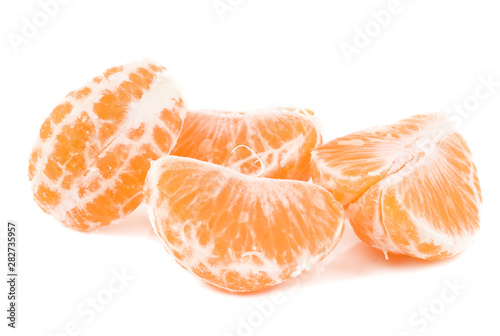 Photo of four fresh pieces tangerine