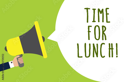 Conceptual hand writing showing Time For Lunch. Business photo showcasing Moment to have a meal Break from work Relax eat drink rest Man holding loudspeaker speech bubble message speaking loud © Artur