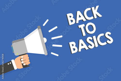Text sign showing Back To Basics. Conceptual photo Return simple things Fundamental Essential Primary basis Man holding megaphone loudspeaker blue background message speaking loud © Artur
