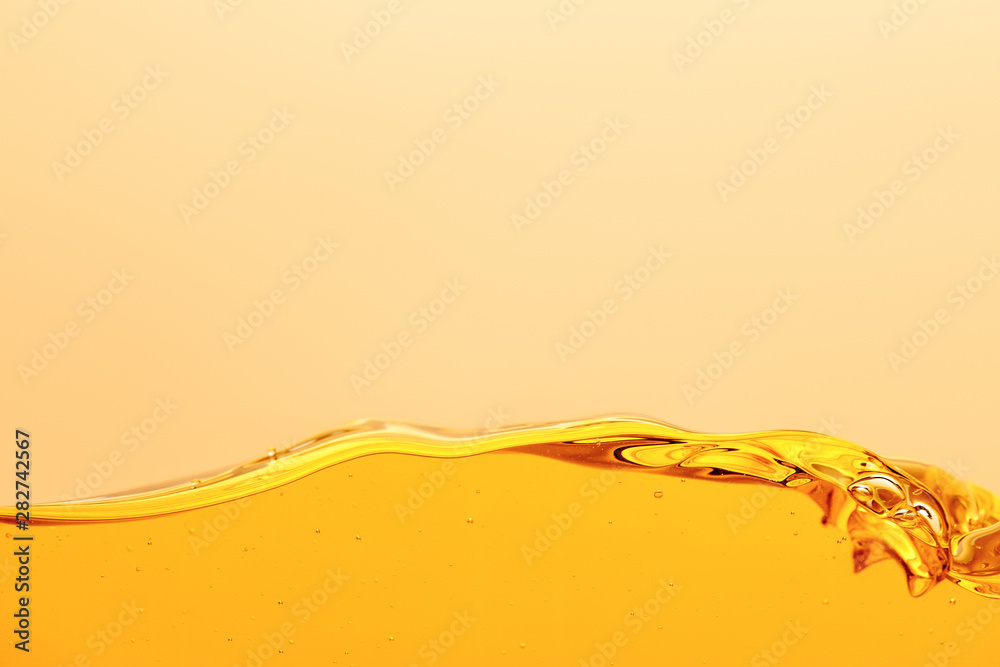 smooth yellow bright liquid with wave isolated on yellow