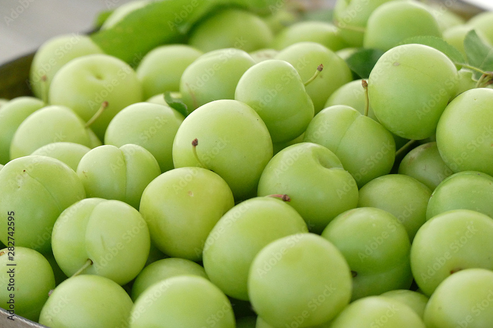 close-up of green sour plums, fresh green plums, close-up of green sour plums, fresh green plums,