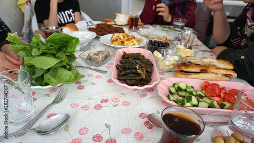 Turkish breakfast table and turkey specific foods  raw meatballs  cig kofte  leaves stuffed patatas fries etc ...