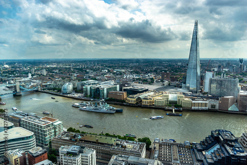 London skyline including Shard and Tower Bridge, city escape at cloudy day 