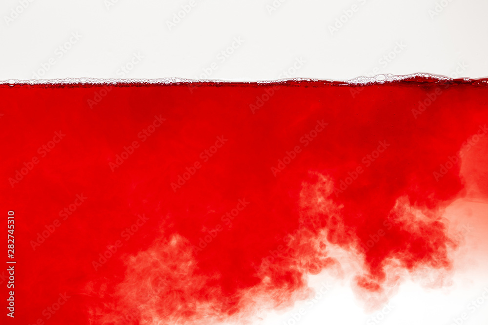 abstract red cloud in liquid with bubbles on surface isolated on white abstract red cloud in liquid with bubbles on surface isolated on white