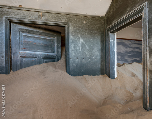 Sand has invaded and taken over these rooms in Kolmanskoppe, Namibia photo