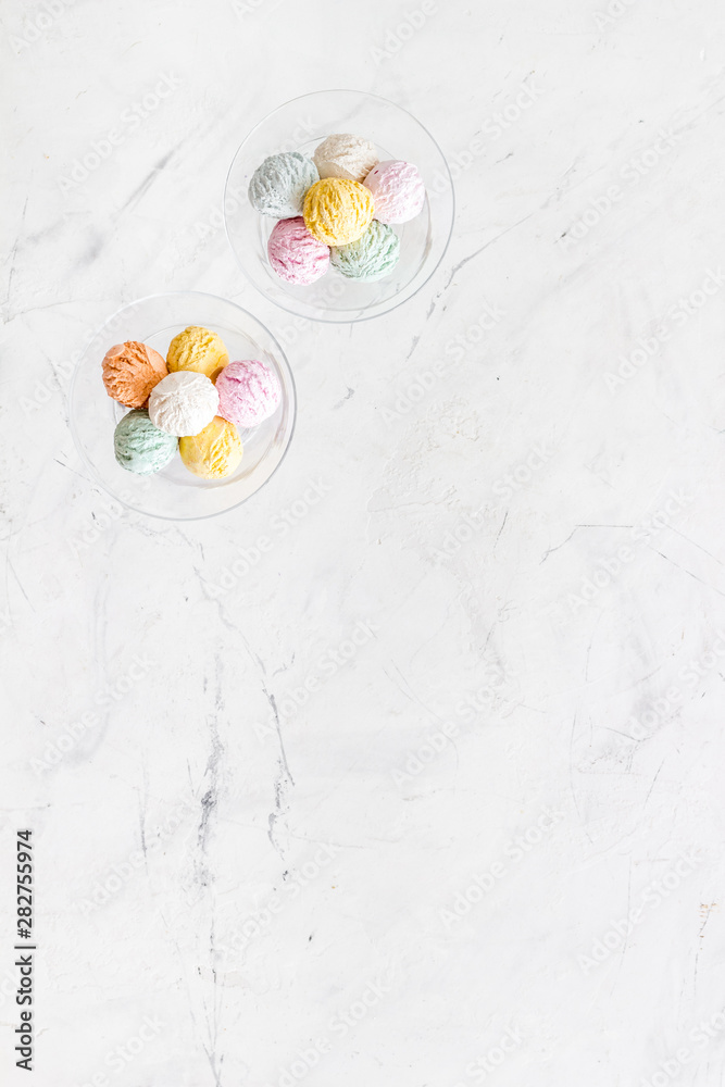 Ice-cream scoops in vase on marble backgroung top view mockup Ice-cream scoops in vase on marble backgroung top view mockup