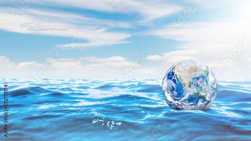 Ecology and Pollution Concept   Blue planet earth globe floating on blue water.  Elements of this image furnished by NASA. 