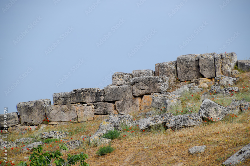 Limestone blocks an earthquake-destroyed wall of city of Hierapolis. Limestone blocks an earthquake-destroyed wall of city of Hierapolis.