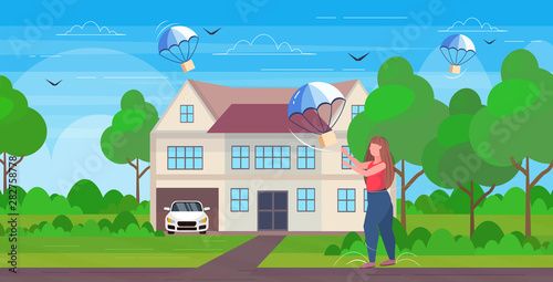 fat woman catching parcel box falling down with parachute from sky transportation shipping package air mail express delivery concept cottage house landscape background full length flat horizontal