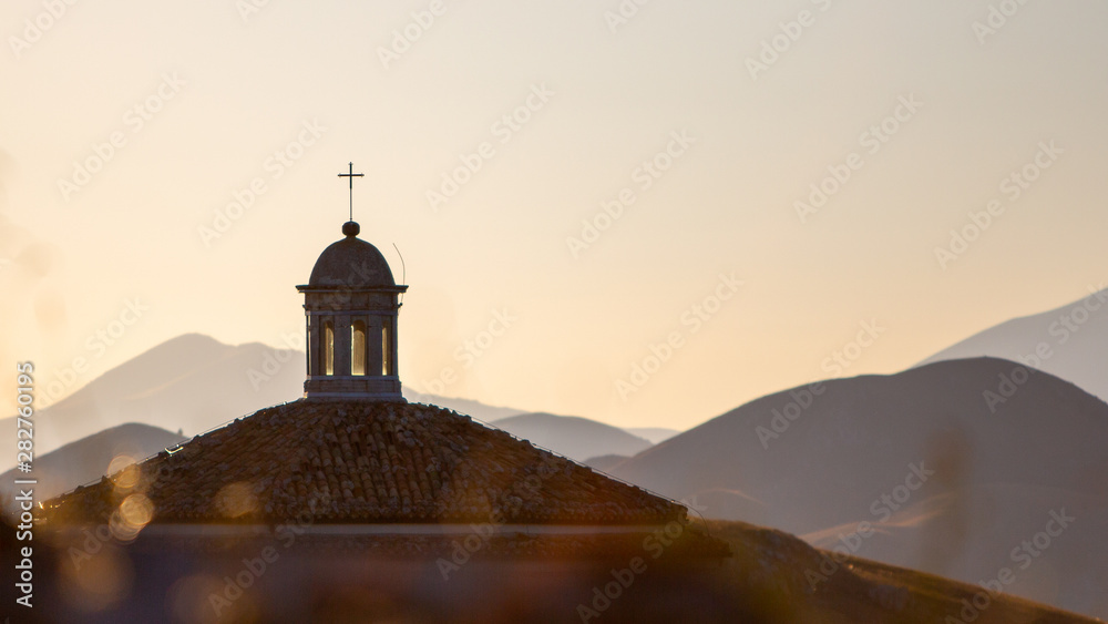 Sunset church steeple mountains