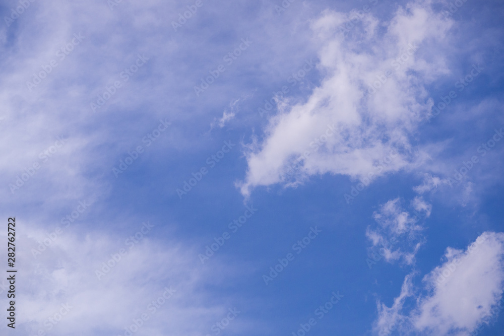 The vast blue sky and clouds sky background with tiny clouds