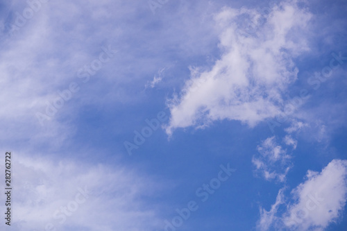 The vast blue sky and clouds sky background with tiny clouds