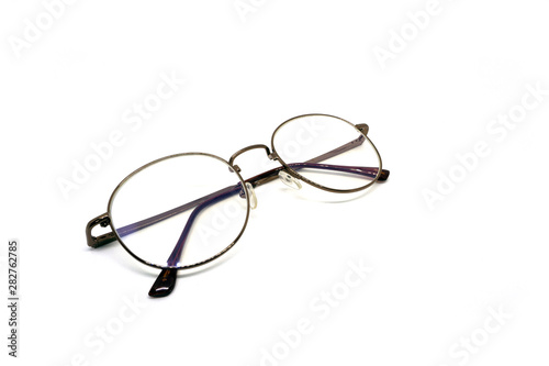 Classic vintage brown stylish round optical glasses on white background,isolated.