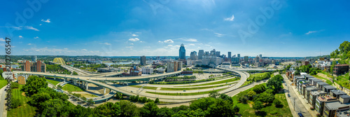 Aerial panoramic view of Cincinnati downtown from the east on a sunny afternoon with twisting highways and bridges © tamas