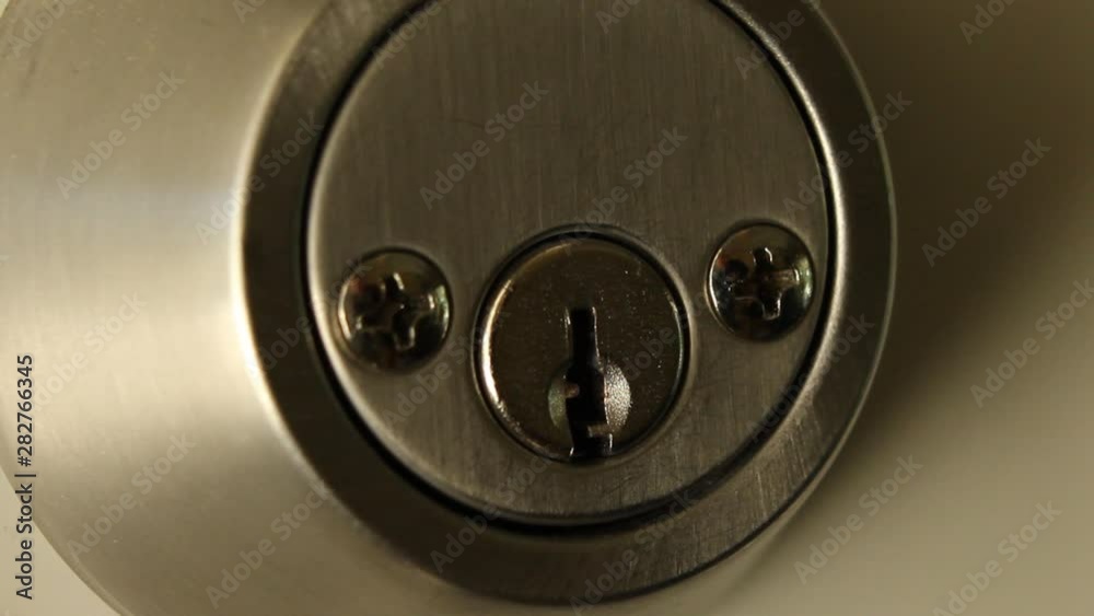 Key Inserted into Deadbolt Door Lock Residential Medium Close Key Inserted into Deadbolt Door Lock Residential Medium Close