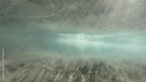 underwater view of shipman beach waves in slow-motion, glittering sand and brackish water makes for some amazing shots photo