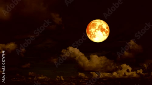 blood moon and cloud moving on noght sky photo