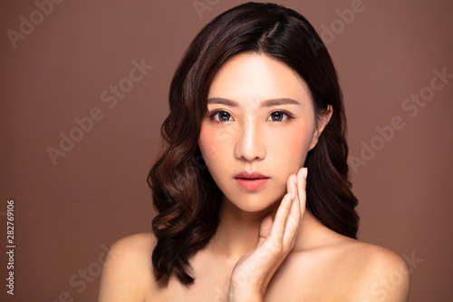 Beautiful young woman with natural makeup and clean skin