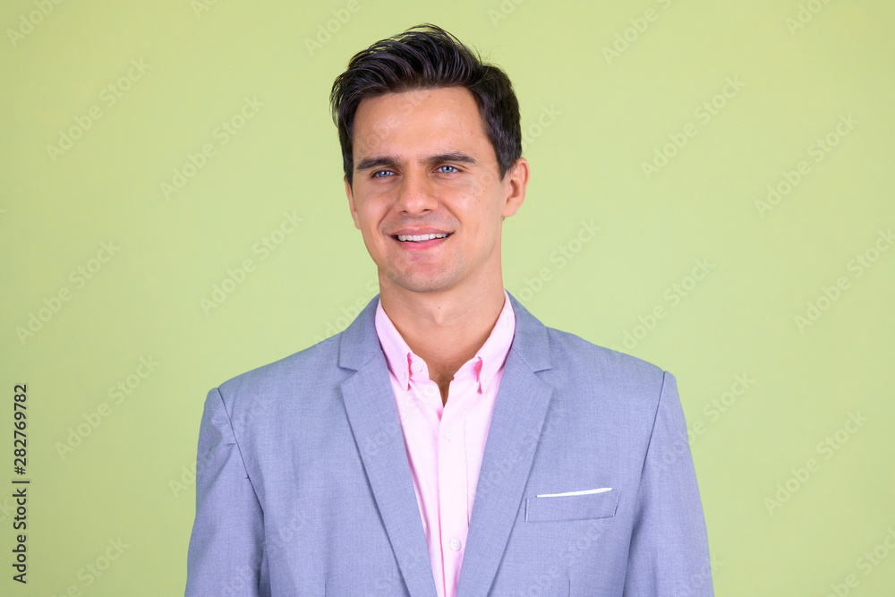 Face of happy young handsome businessman in suit thinking Face of happy young handsome businessman in suit thinking