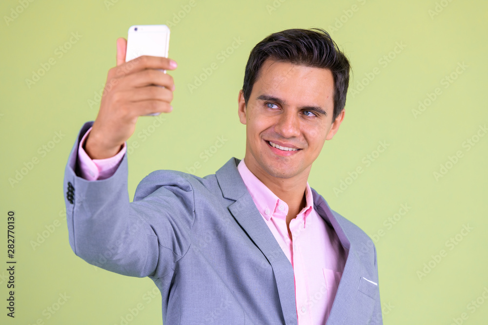Portrait of happy young handsome businessman taking selfie Portrait of happy young handsome businessman taking selfie
