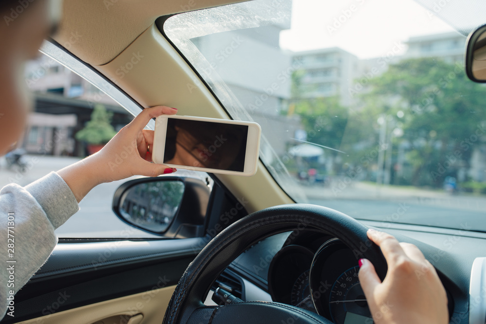 woman sit in modern car in front of dashboard