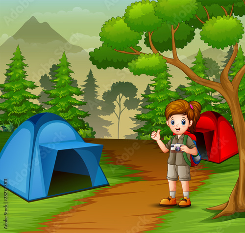 Girl in scout uniform exploring the forest