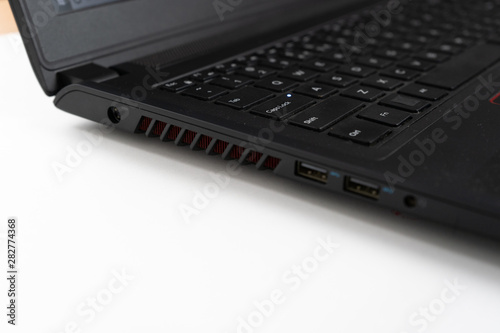 Wallpaper Mural Details of hand pushing usb cable into usb slot on laptop. Torontodigital.ca