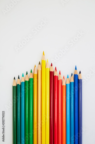 Colorful wooden pencils for drawing on white