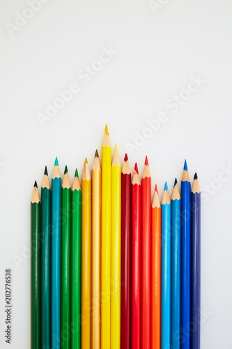 Colorful wooden pencils for drawing on white