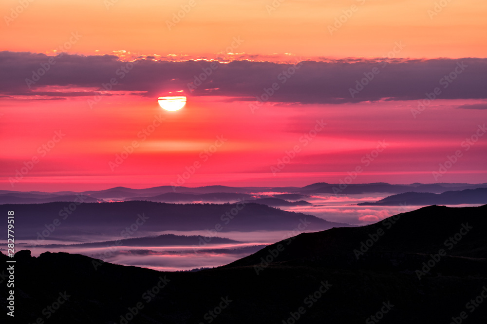 Mountains' silhouettes and pink sky. Awesome sunrise in Bieszczady Mountains. Poland