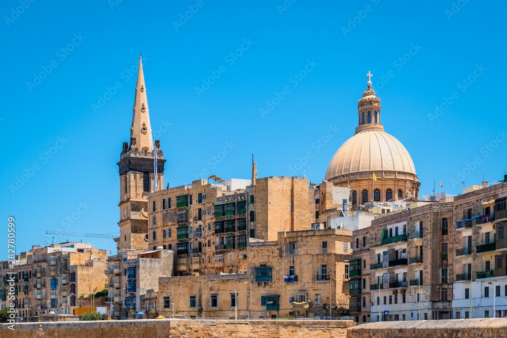 View of cathedral and belltower in old city centre of Valletta, Malta.