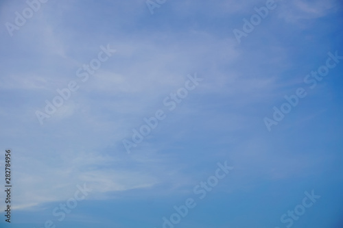 Clear blue sky with white cloud pattern background in sunshine day