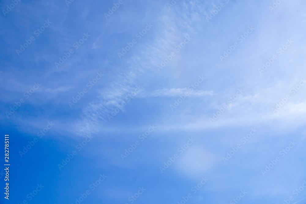 Clear blue sky and white cloud with sunlight from the sun,nature background in sunshine day Clear blue sky and white cloud with sunlight from the sun,nature background in sunshine day