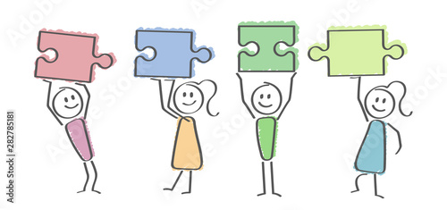 viele Personen mit Puzzleteilen