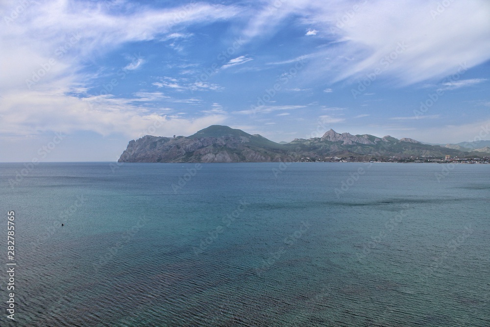 Rock near the sea. Mountain near the sea.