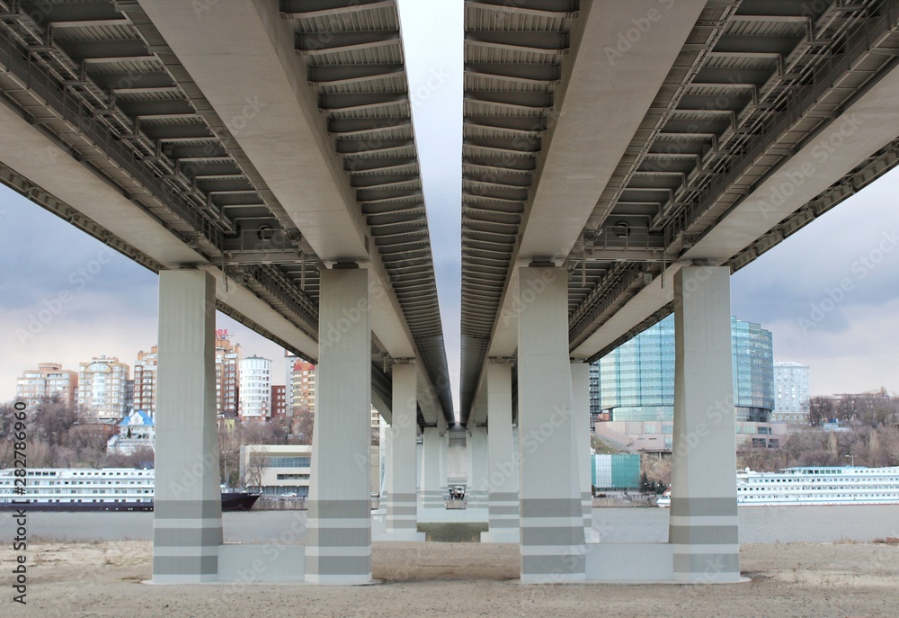 View of the bridge from below. Bridge piers. View of the bridge from below. Bridge piers.