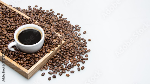 Fototapeta Naklejka Na Ścianę i Meble -  cup of coffee and beans on white background with text space