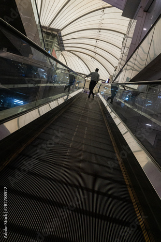 man on a escalator 