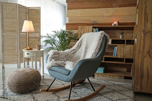 Bilde på lerret Cozy rocking chair in interior of living room