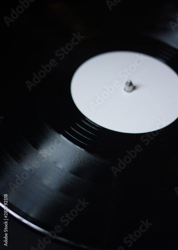 new blank white label black vinyl record on turntable
