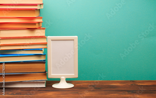  pile of old books, frame copy space on blue background - Image