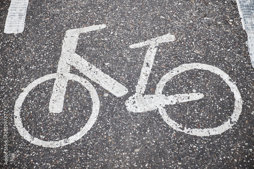 Image of a bicycle Bicycle road marking white on asphalt close-up full frame