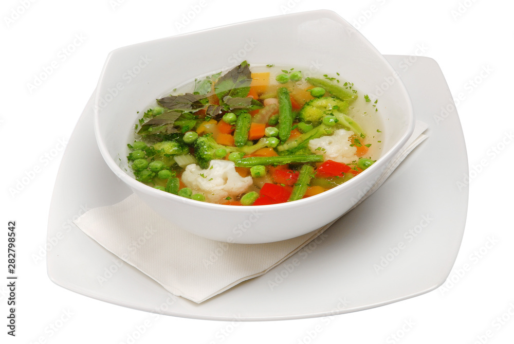 Vegetable soup in bowl on a white isolated background Vegetable soup in bowl on a white isolated background