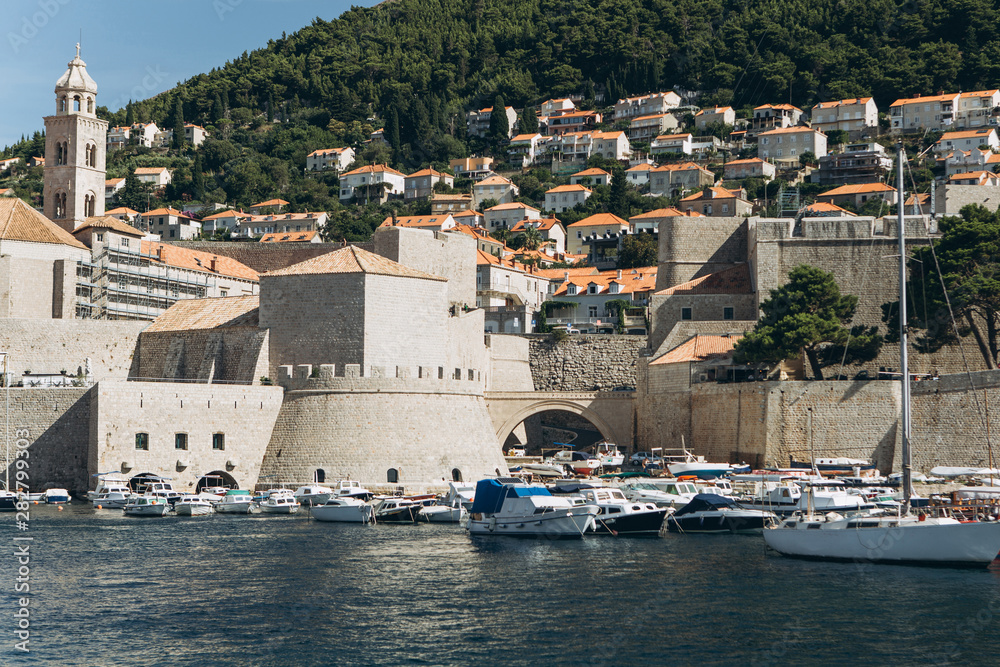 Beautiful view of traditional old buildings and boats in the old town in Dubrovnik in Croatia.