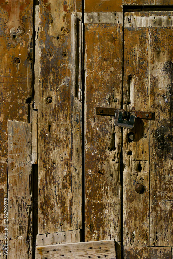 Syracuse, Sicily, Italy An old door and lock in Ortygia or the old town. Syracuse, Sicily, Italy An old door and lock in Ortygia or the old town.