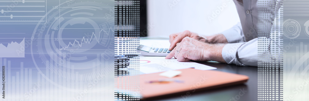 Senior businessman working on business report; panoramic banner Senior businessman working on business report; panoramic banner