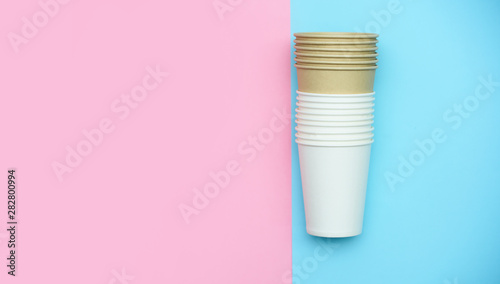 Paper white glasses for drinks and coffee. Glasses colored background