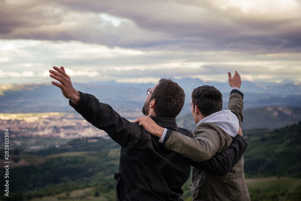 Christian worship and praise. Two young man are praying and worshiping in the evening. Christian worship and praise. Two young man are praying and worshiping in the evening.