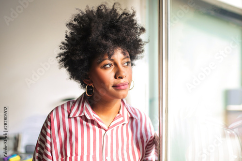 Beautiful woman looking out of the window